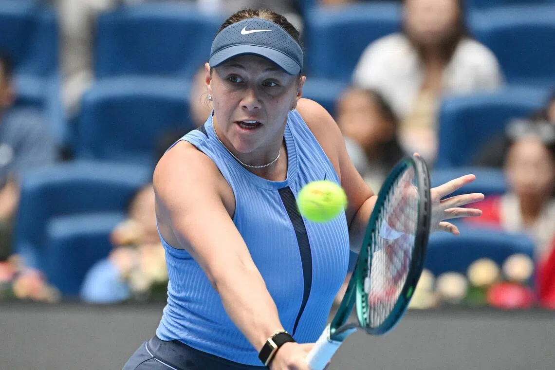 Amanda Anisimova hits a return to Coco Gauff during their women’s singles semi-final match at the China Open.