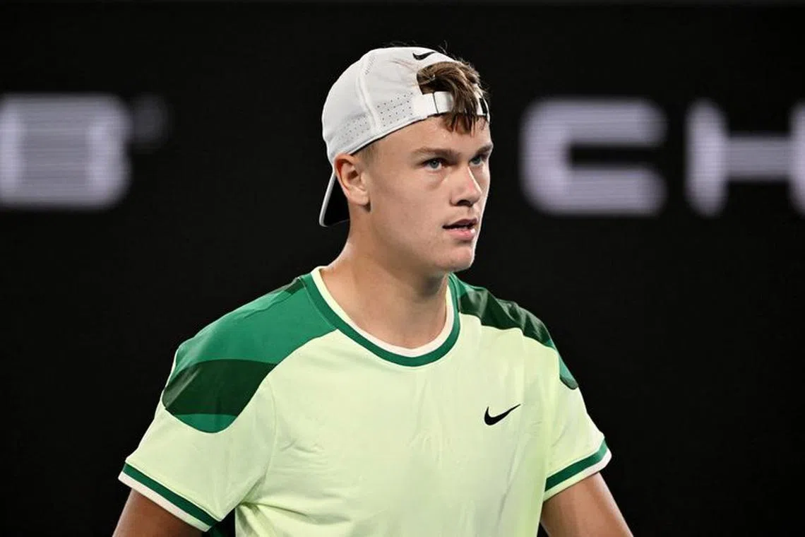FILE PHOTO: Tennis - Australian Open - Melbourne Park, Melbourne, Australia - January 18, 2024 Denmark's Holger Rune reacts during his second round match against France's Arthur Cazaux REUTERS/Tracey Nearmy/File Photo