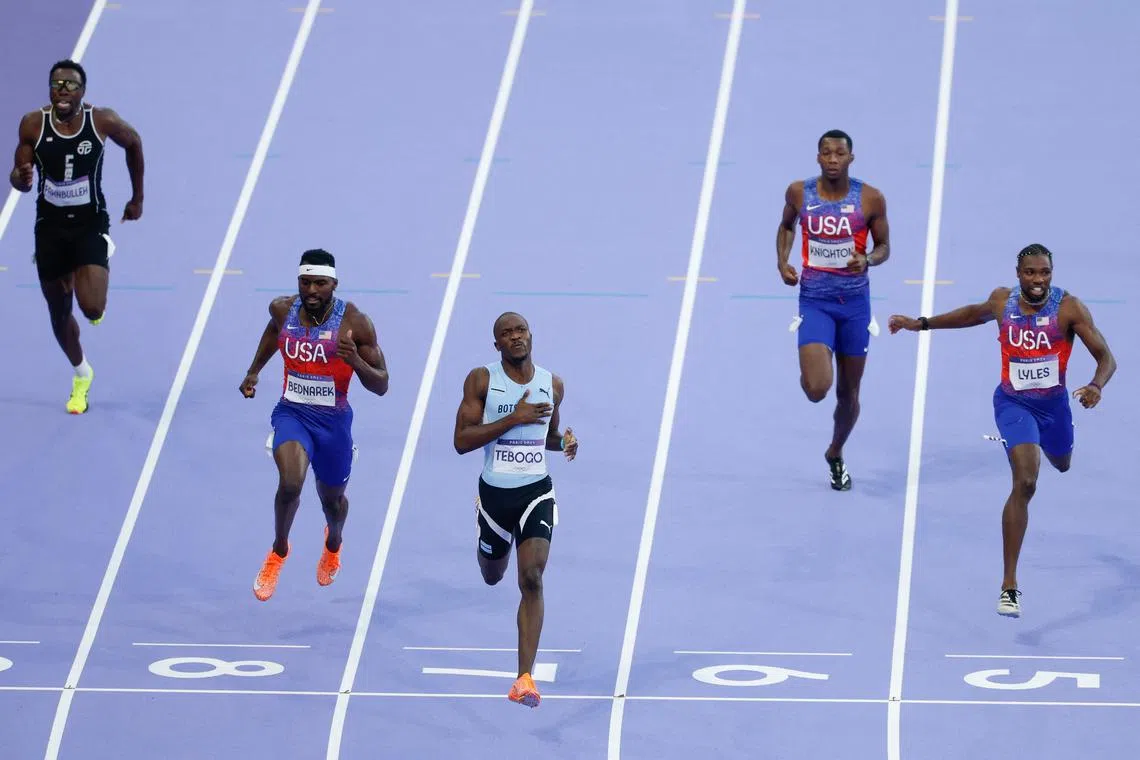 Botswana's Letsile Tebogo crosses the finish line to win the men's 200m final.