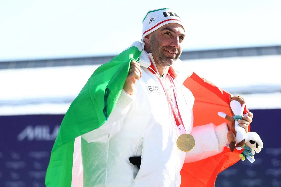 Milano Cortina 2026 Paralympics - Para Snowboard - Men's Snowboard Cross SB-LL2 Victory Ceremony - Cortina Para Snowboard Park, Cortina d'Ampezzo, Italy - March 08, 2026.  Gold medallist Emanuel Perathoner of Italy celebrates after winning the big final REUTERS/Lisi Niesner
