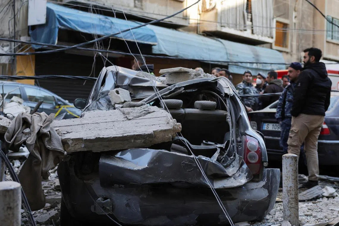Debris lies on a damaged vehicle at site of an Israeli strike on an apartment building, in central Beirut, Lebanon, March 11, 2026, following an escalation between Hezbollah and Israel amid the U.S.-Israeli conflict with Iran. REUTERS/Emilie Madi