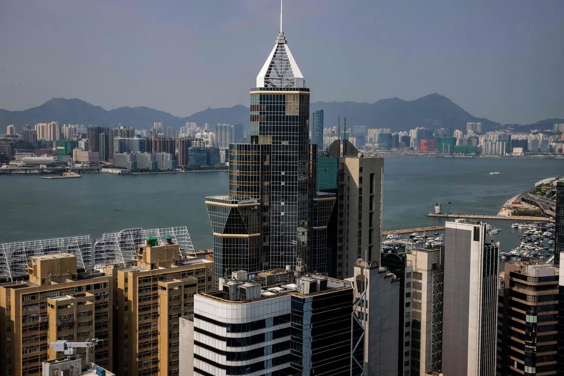 Commercial and residential buildings are seen in Hong Kong on September 15, 2022. - The amount of vacant top-tier office space has more than doubled in Hong Kong over the last three years as companies downsize operations, researchers have found, warning that demand could remain soft even if pandemic controls are lifted. (Photo by ISAAC LAWRENCE / AFP)