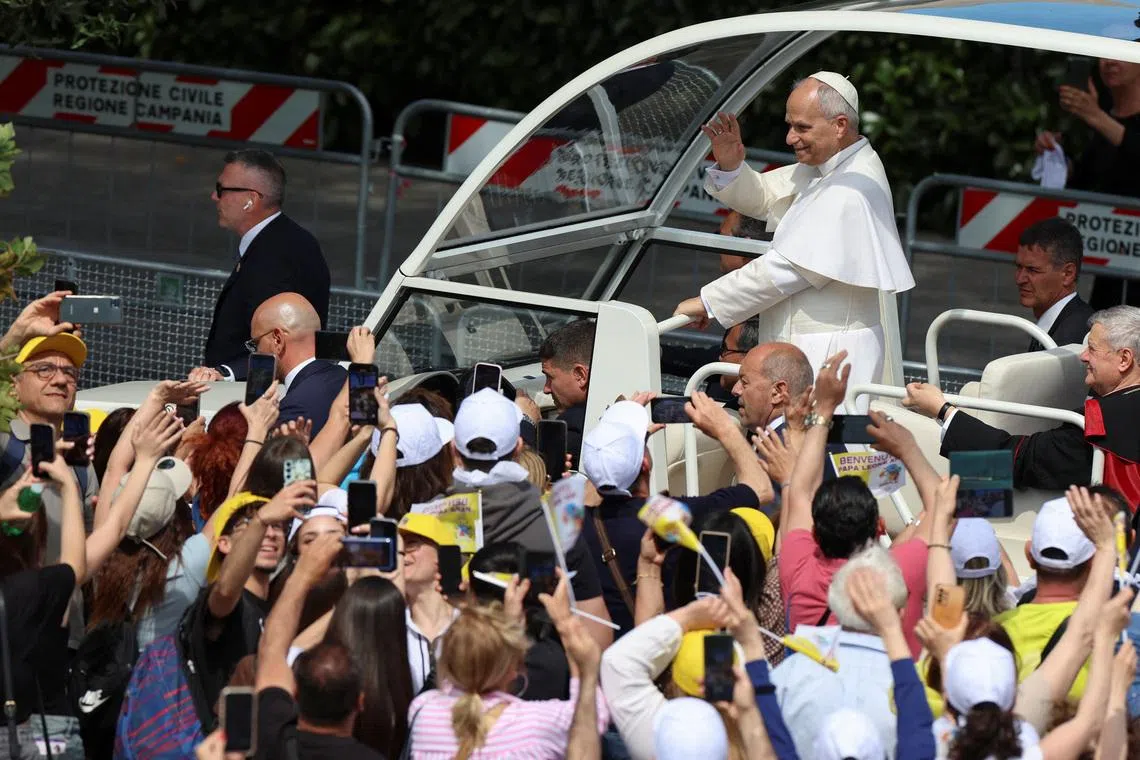 Pope Leo arriving for a meeting with mayors and faithful of various municipalities of the so-called "Land of Fires," an area long plagued by illegal toxic waste dumping and burning, in Acerra, Italy, on May 23.