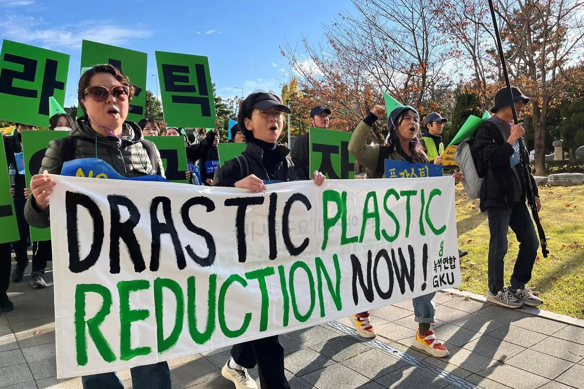 FILE PHOTO: Climate activists march on a street to demand stronger global commitments to fight plastic waste at the upcoming fifth session of the Intergovernmental Negotiating Committee (INC-5), in Busan, South Korea, November 23, 2024.   REUTERS/Minwoo Park/File Photo