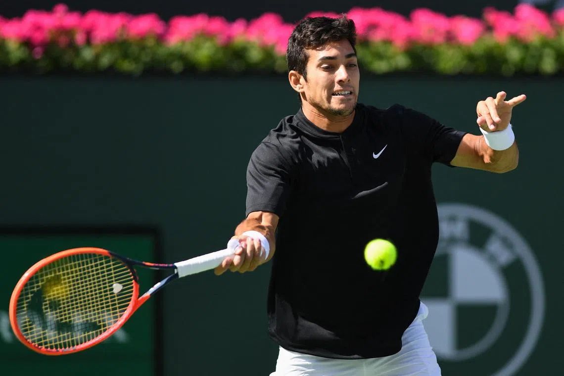 Cristian Garin hits a forehand during his third round match against Casper Ruud.