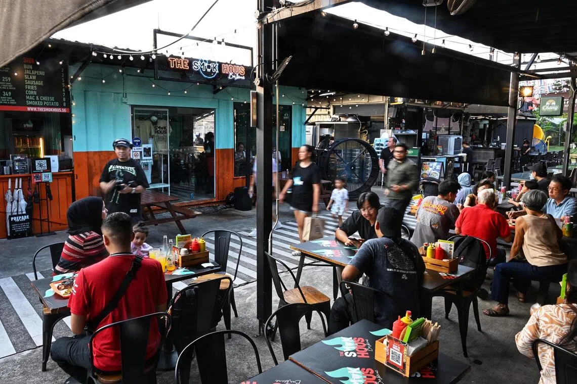 Diners at The Smok Hous Barbecue at the Punggol East Container Park on Sept 1.