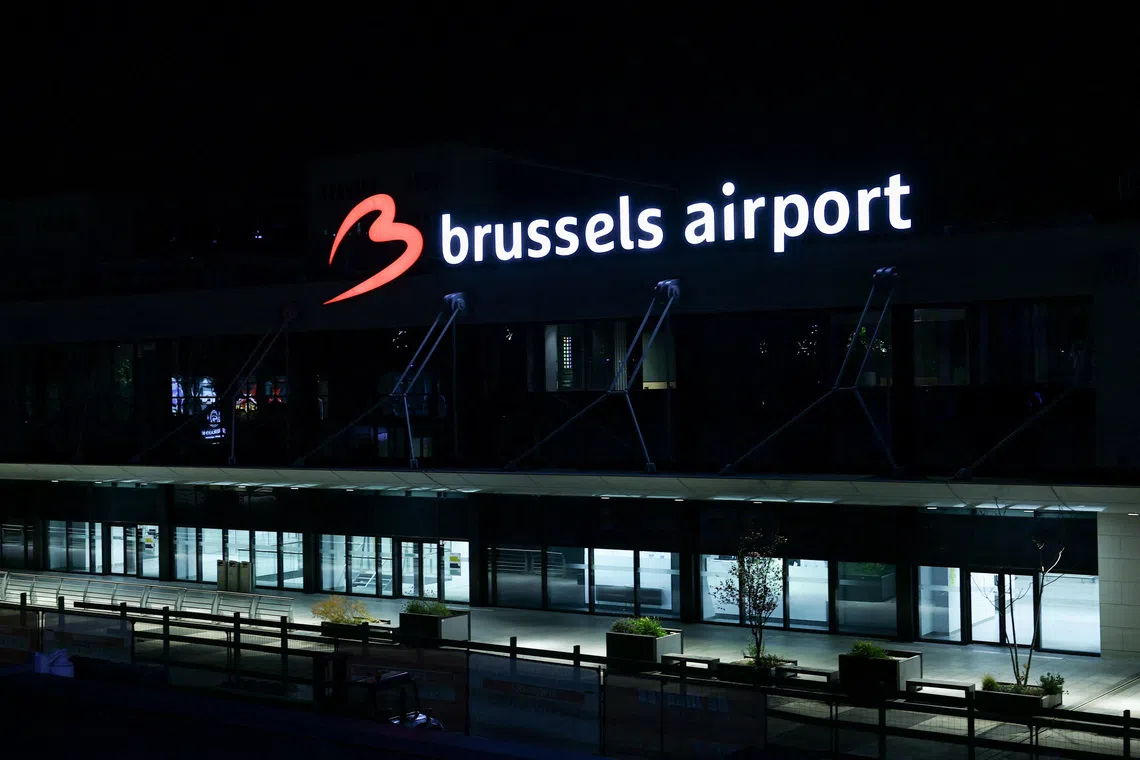 A sign is illuminated outside the Brussels Airport after the Belgian air traffic control service reported a sighting of a drone, in Zaventem, Belgium, November 4, 2025. REUTERS/Yves Herman