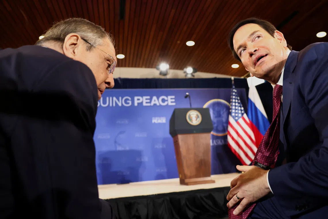Russian Foreign Minister Sergei Lavrov and U.S. Secretary of State Marco Rubio talk as they attend a press conference held by U.S. President Donald Trump and Russian President Vladimir Putin following their meeting to negotiate an end to the war in Ukraine, at Joint Base Elmendorf-Richardson, in Anchorage, Alaska, U.S., August 15, 2025. REUTERS/Kevin Lamarque