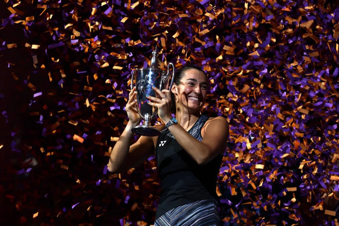 Caroline Garcia of France celebrates with the Billie Jean King Trophy after defeating Aryna Sabalenka 7-6 (6-4), 6-4 to win the WTA Finals on Monday.