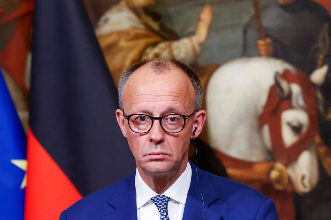 German Chancellor Friedrich Merz attends a press conference with Italian Prime Minister Giorgia Meloni (not pictured) at Chigi Palace in Rome, Italy, May 17, 2025. REUTERS/Remo Casilli/File Photo