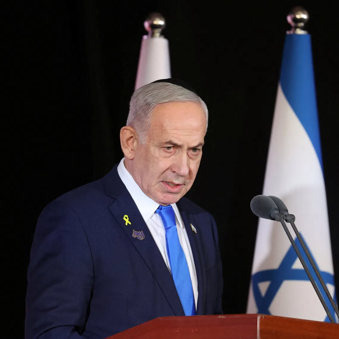 Israeli Prime Minister Benjamin Netanyahu participates in the state memorial ceremony for the fallen of the Iron Swords War on Mount Herzl, in Jerusalem, 16 October 2025.    Alex Kolomoisky/Pool via REUTERS