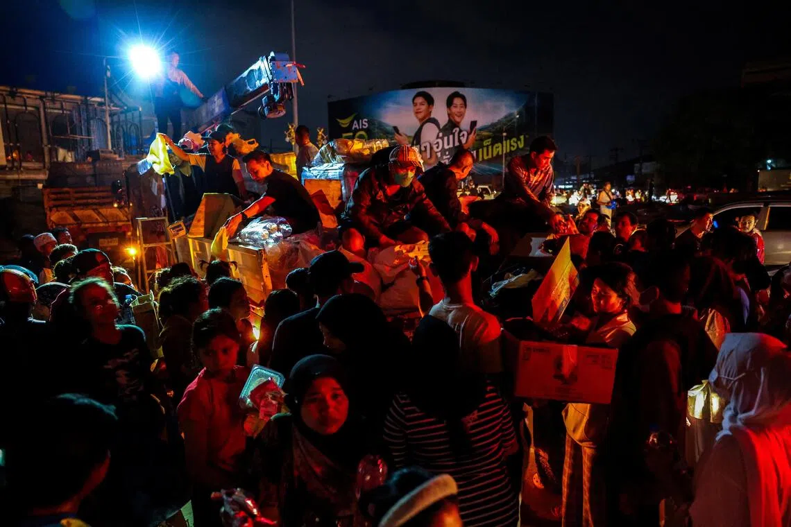 Volunteers distribute relief supplies following deadly flooding in Hat Yai district, Songkhla province, Thailand, Nov 29, 2025.