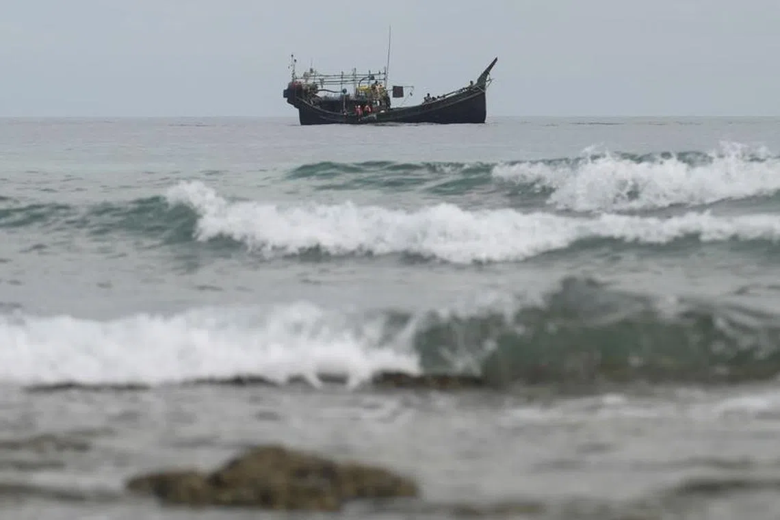 FILE PHOTO: A wooden boat that carried Rohingya Muslims is seen off the coast in Sabang, Aceh province, Indonesia, November 22, 2023. REUTERS/Riska Munawarah/File Photo