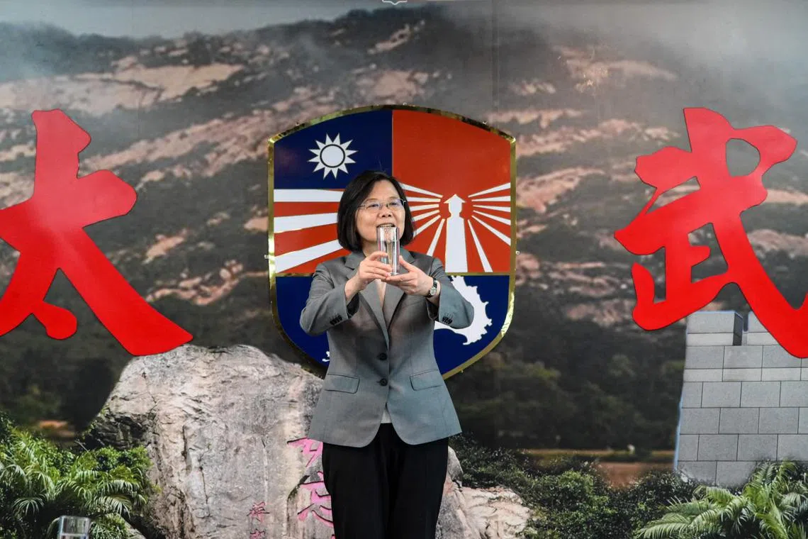 Taiwan President Tsai Ing-wen toasts to the relatives of fallen soldiers during a lunch at a military base to mark the 65th anniversary of the Second Taiwan Strait Crisis in Kinmen on August 23, 2023. (Photo by Sam Yeh / AFP)