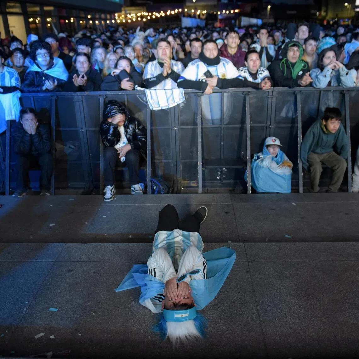 Argentina fans in Lionel Messi’s home town of Rosario react during the World Cup final against Spain on July 19.