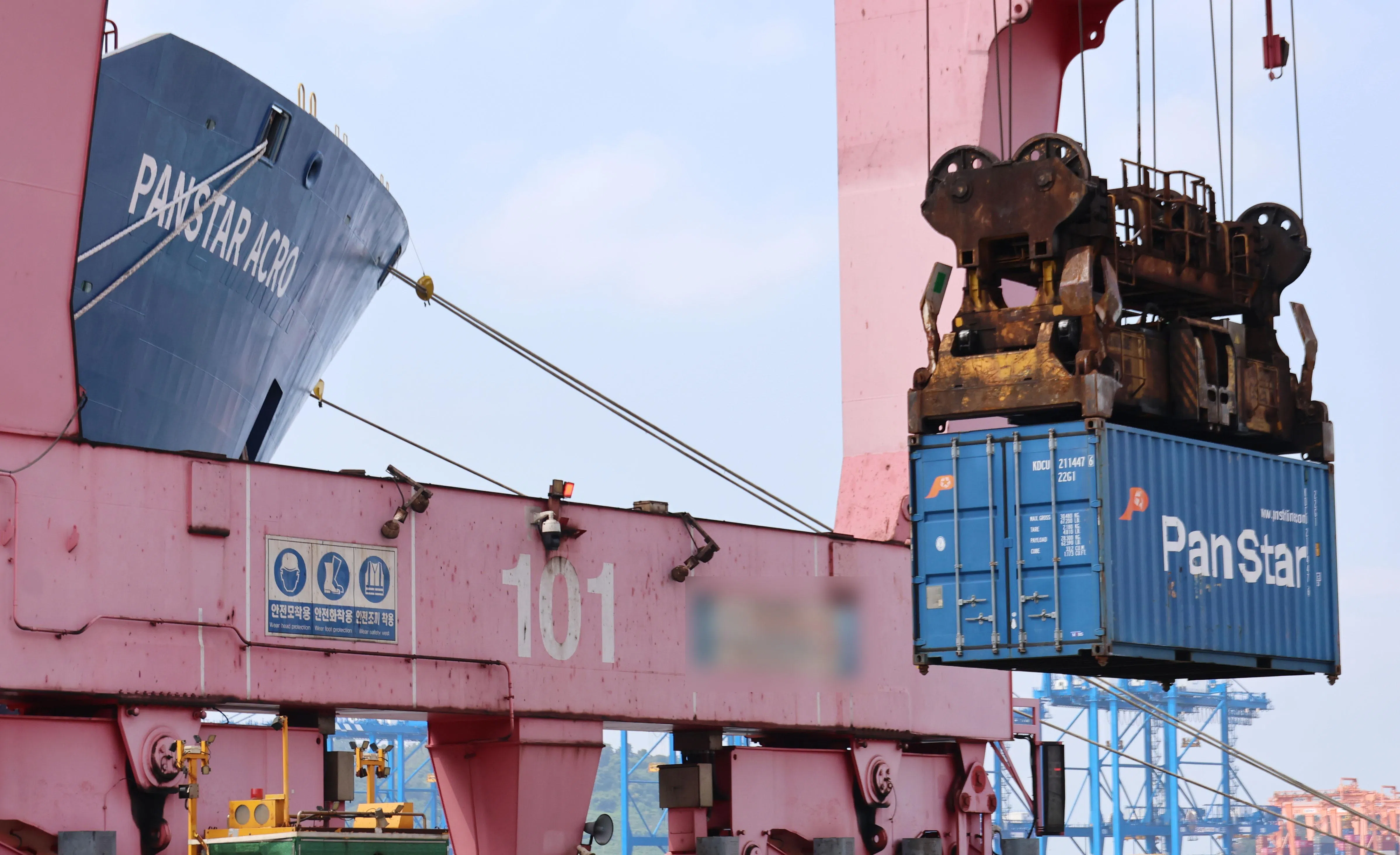 Cargo is loaded onto the PanStar Acro container ship at Busan New Port on Aug 22, ahead of its journey to Europe via the Arctic.
