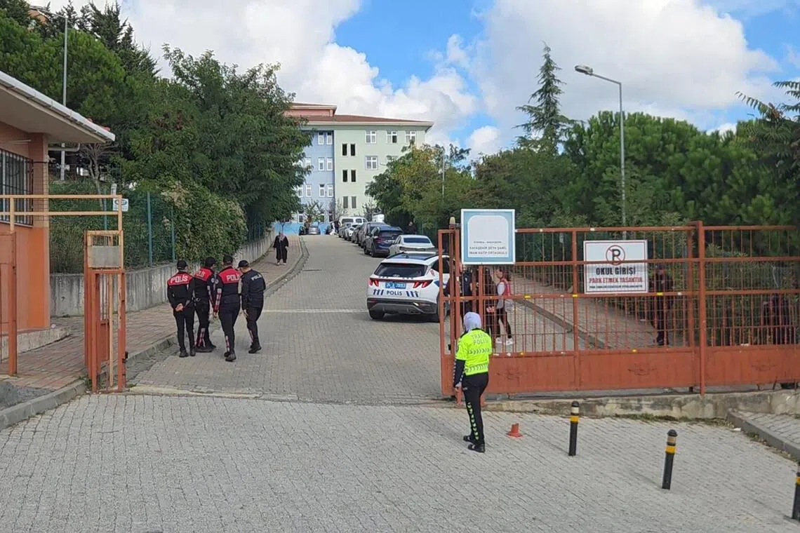 Turkish police officers at the entrance of a school at Basaksehir in Istanbul after a teenage girl stabbed eight students on Oct 6.