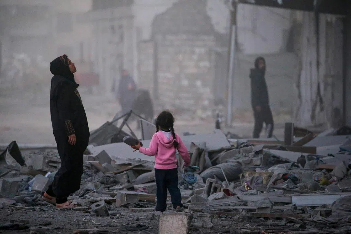 Palestinians inspecting a destroyed building following an Israeli air strike on Gaza City on March 22. Israeli forces resumed air strikes on Gaza on March 18, ending a ceasefire that had been in place since Jan 19. 
