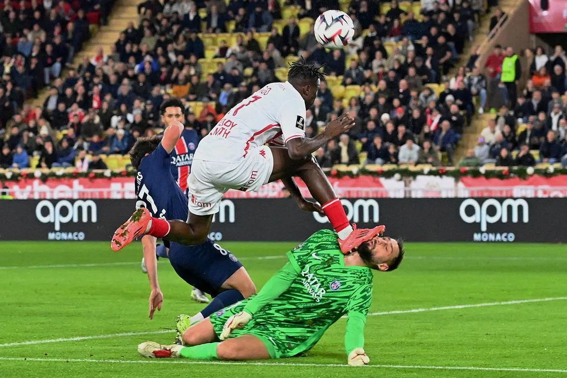 Soccer Football - Ligue 1 - AS Monaco v Paris St Germain - Stade Louis II, Monaco - December 18, 2024 Paris St Germain's Gianluigi Donnarumma in action with AS Monaco's Wilfried Singo REUTERS/Alexandre Dimou/File Photo