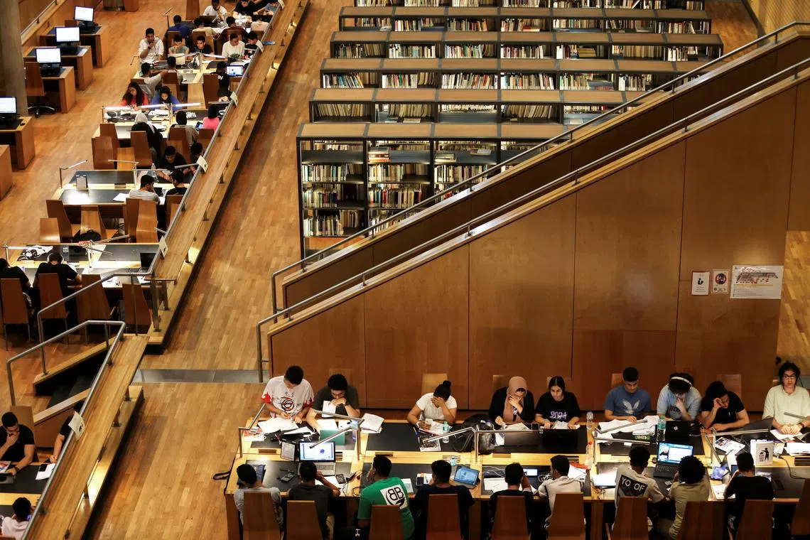 FILE PHOTO: Students study for their high school certificate exams at the Library of Alexandria during the power-off time that the government applied to overcome the overload amid a heatwave, as Egyptians experience frequent power cuts after the government said the lack of natural gas supplies feeding the country's electricity grid has fueled the crisis, in the Mediterranean city of Alexandria, Egypt, June 26, 2024. REUTERS/Mohamed Abd El Ghany/File Photo