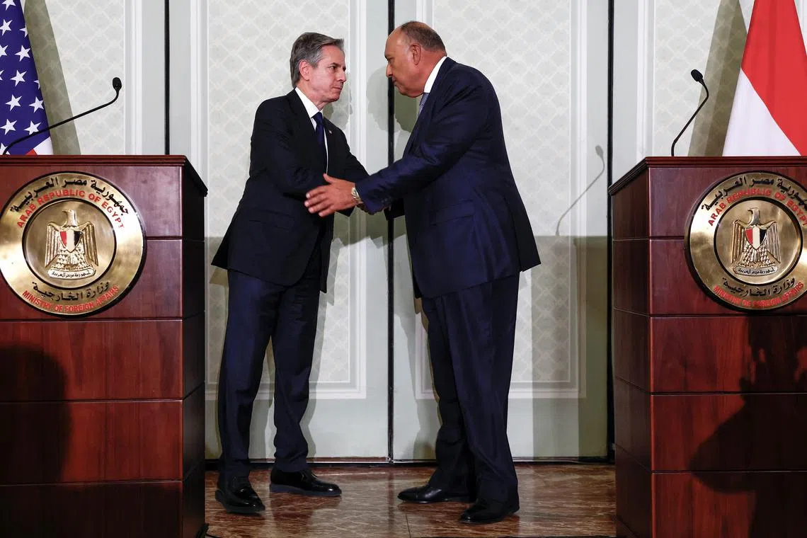 U.S. Secretary of State Antony Blinken shakes hands with Egyptian Foreign Minister Sameh Shoukry, as they hold a joint press conference, during U.S. Secretary of State Blinken's visit to Cairo, Egypt March 21, 2024. REUTERS/Evelyn Hockstein/Pool