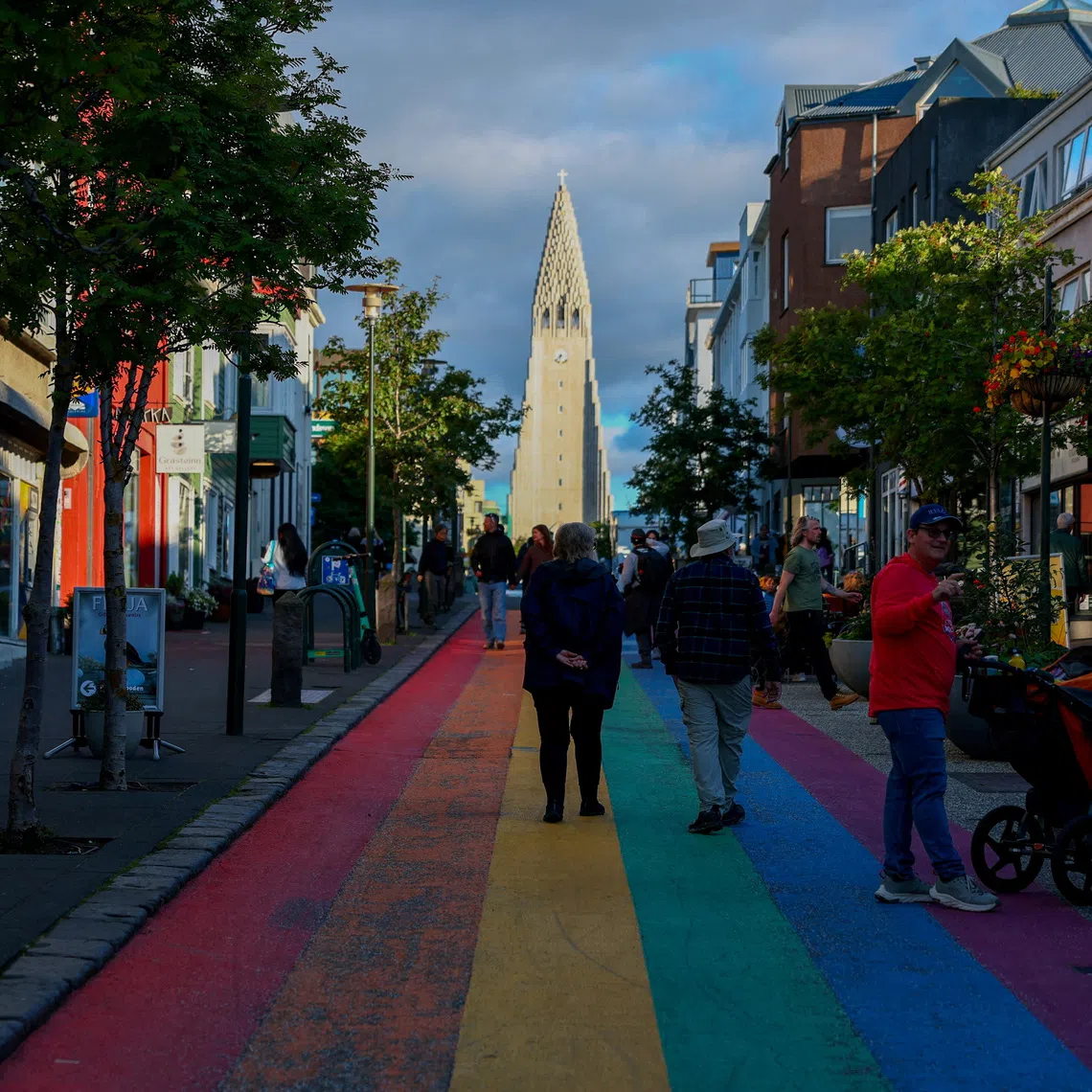 FILE PHOTO: People walk on Rainbow Street ahead of a referendum on whether Iceland should resume accession negotiations with the European Union, in Reykjavik, Iceland, August 10, 2026. REUTERS/Denis Balibouse/File Photo