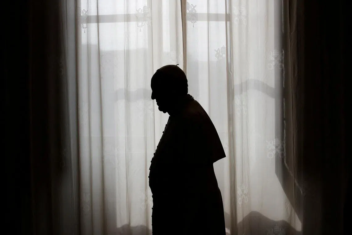 FILE PHOTO: Pope Francis is silhouetted against a window light at the end of a meeting with Equatorial Guinea's President Teodoro Obiang Nguema Mbasogo at the Vatican October 25, 2013. REUTERS/Max Rossi/File Photo