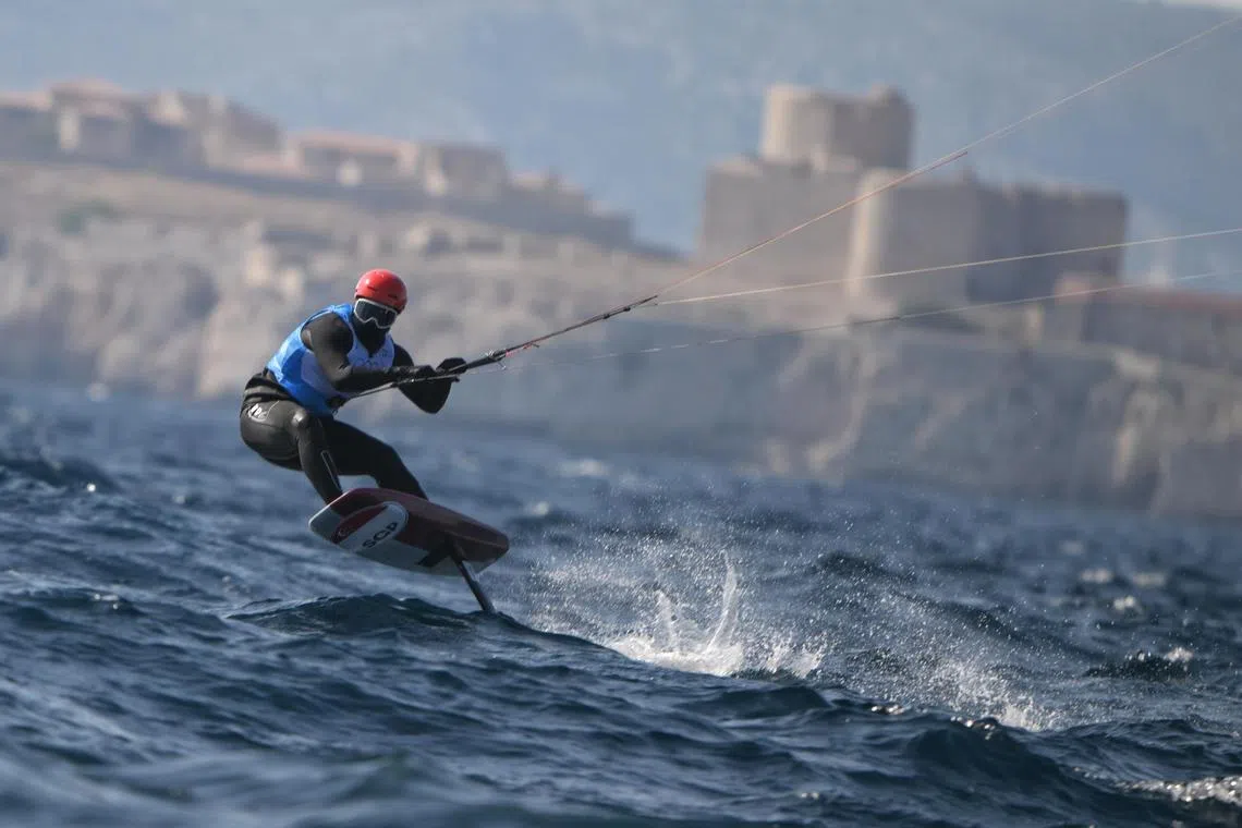 Singaporean Kitefoiler Maximilian Maeder in action during race 1 of the Paris 2024 Olympics Kitefoiling final at the Marseille Marina on August 8, 2024.
