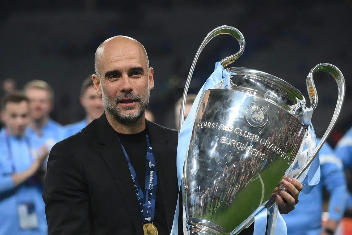 Manchester City manager Pep Guardiola with the Champions League trophy after winning the competition on June 10, 2023. 