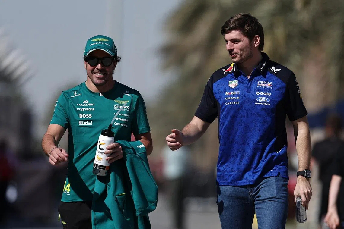 Formula One F1 - Pre Season Testing - Bahrain International Circuit, Sakhir, Bahrain - February 18, 2026 Aston Martin's Fernando Alonso and Red Bull's Max Verstappen during the pre season testing REUTERS/Hamad I Mohammed