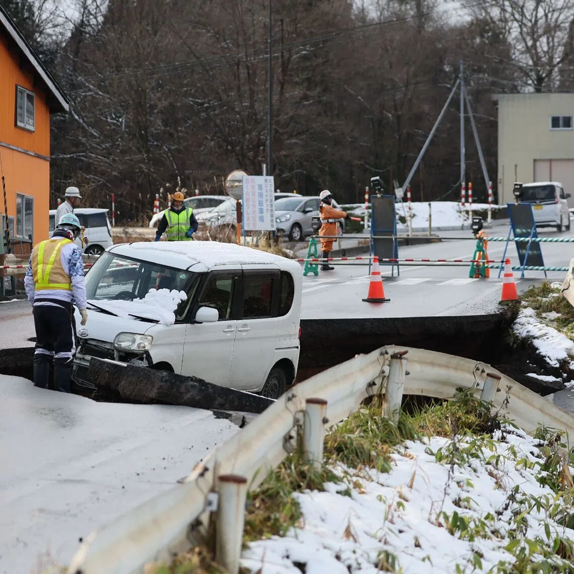 A collapsed road in Tohoku town in Aomori Prefecture on Dec 9, following a 7.5-magnitude earthquake off northern Japan.