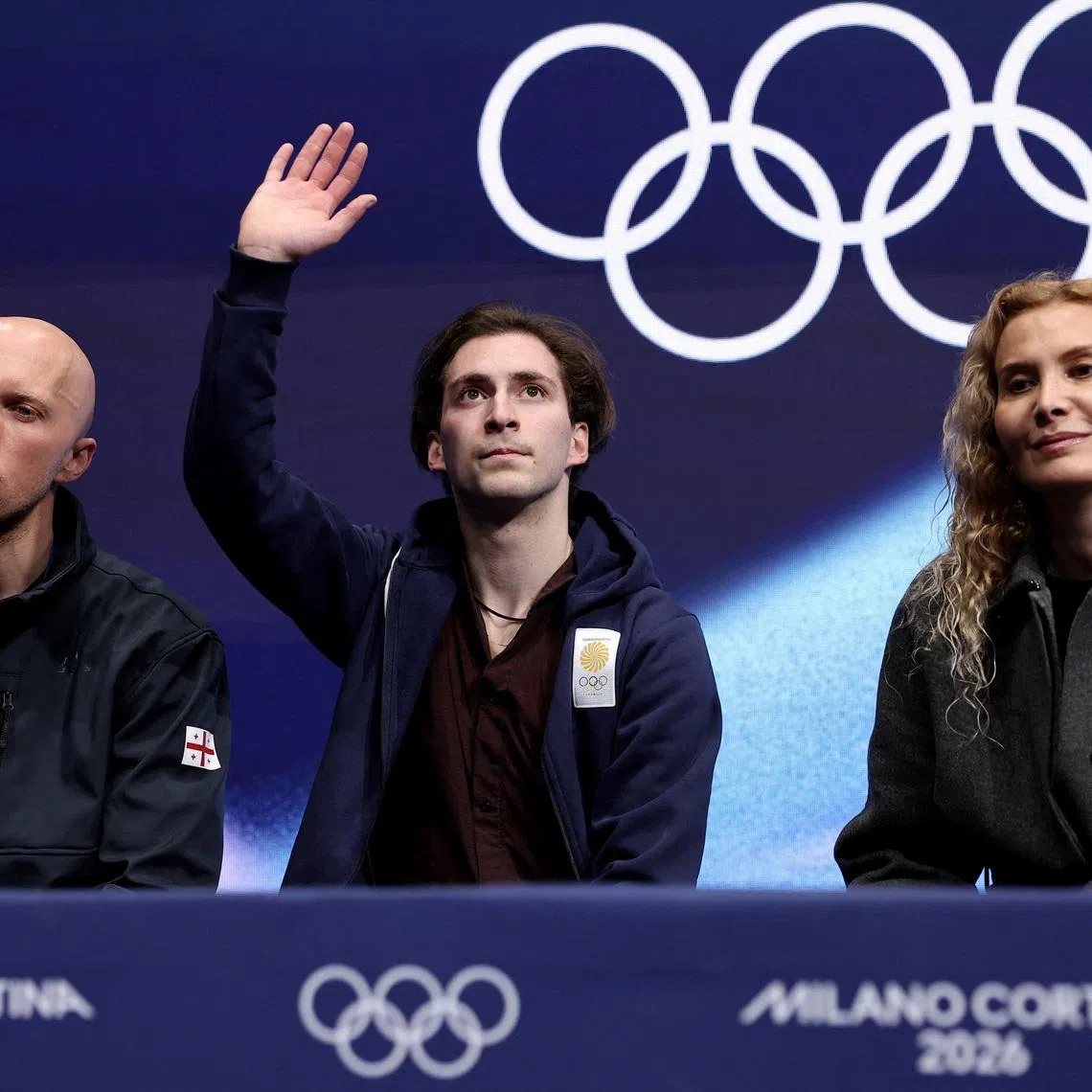 Milano Cortina 2026 Olympics - Figure Skating - Men Single Skating - Short Program - Milano Ice Skating Arena, Milan, Italy - February 10, 2026. Nika Egadze of Georgia with his coaches Eteri Tutberidze and Benoit Richaud after his performance during the Short Program REUTERS/Amanda Perobelli