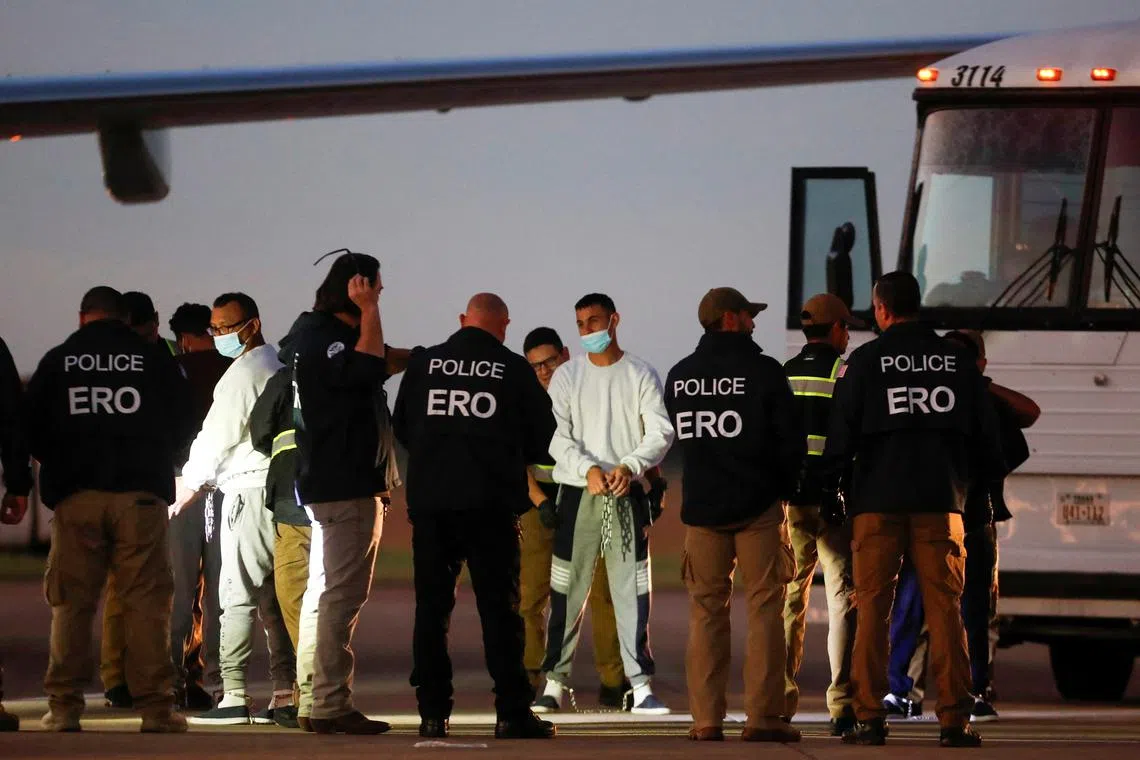 FILE PHOTO: Venezuelan migrants are pat-down before boarding a repatriation flight as a part of an immigration enforcement process, at the Valley International Airport, in Harlingen, Texas, U.S. October 18, 2023. REUTERS/Daniel Becerril/File Photo