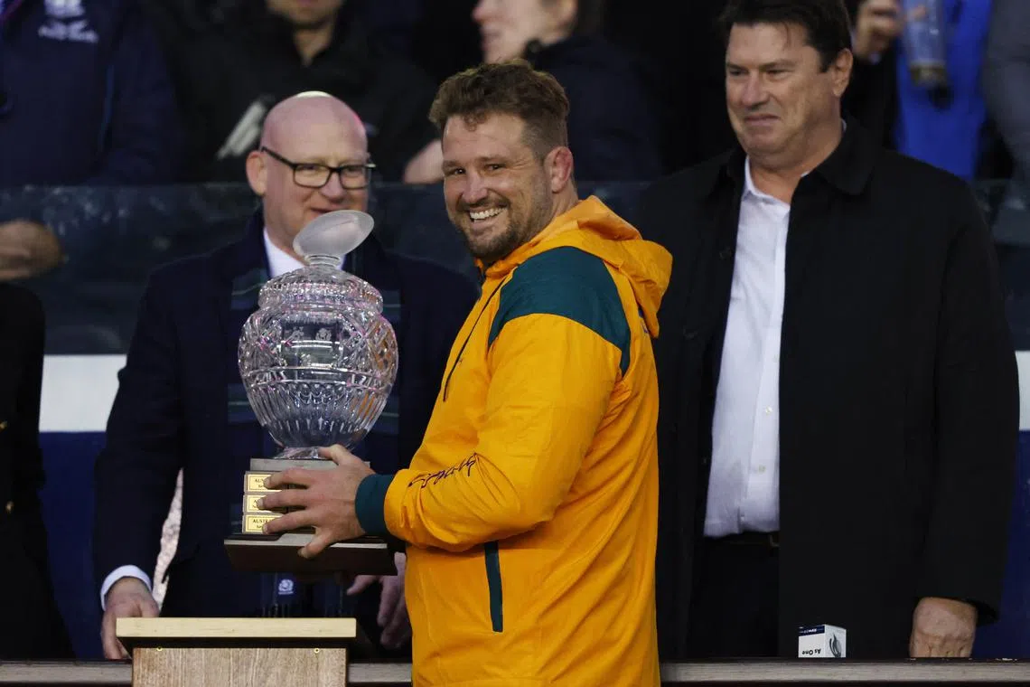 FILE PHOTO: Rugby Union - International - Scotland v Australia - Murrayfield Stadium, Edinburgh, Scotland, Britain - October 29, 2022 Australia's James Slipper celebrates with the trophy after the match REUTERS/Russell Cheyne/File Photo