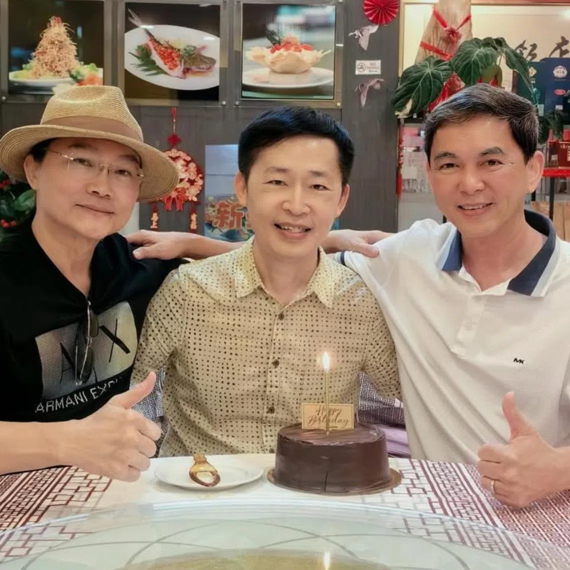 Dr Liang Wern Fook (centre) celebrating his 62nd birthday with old friends Liu Rui Zheng (left) and Wang Bang Ji in April. The three are the original singers of the xinyao song Friends Forever.