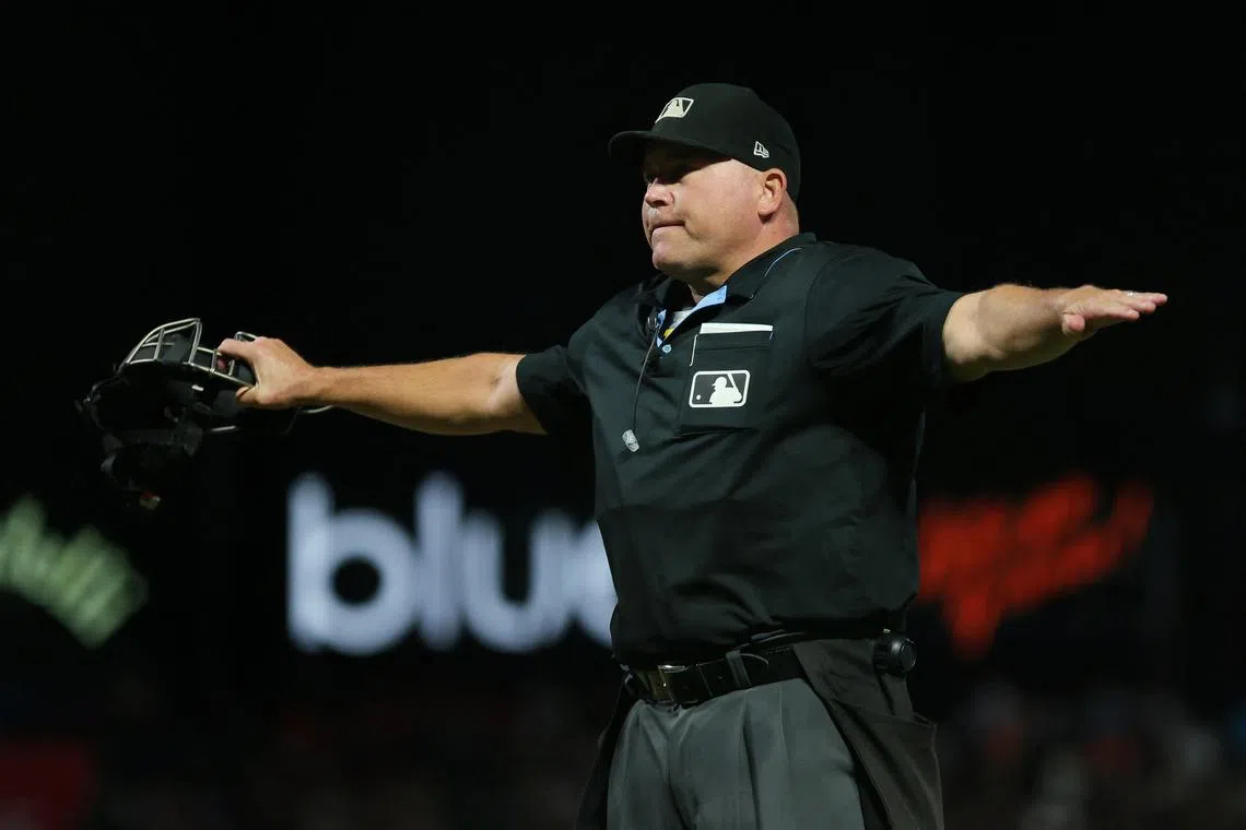 FILE PHOTO: Sep 25, 2023; San Francisco, California, USA; umpire Mark Carlson (6) calls San Diego Padres right fielder Fernando Tatis Jr. (not pictured) safe at first base during the sixth inning against the San Francisco Giants at Oracle Park. Mandatory Credit: Sergio Estrada-USA TODAY Sports/File Photo