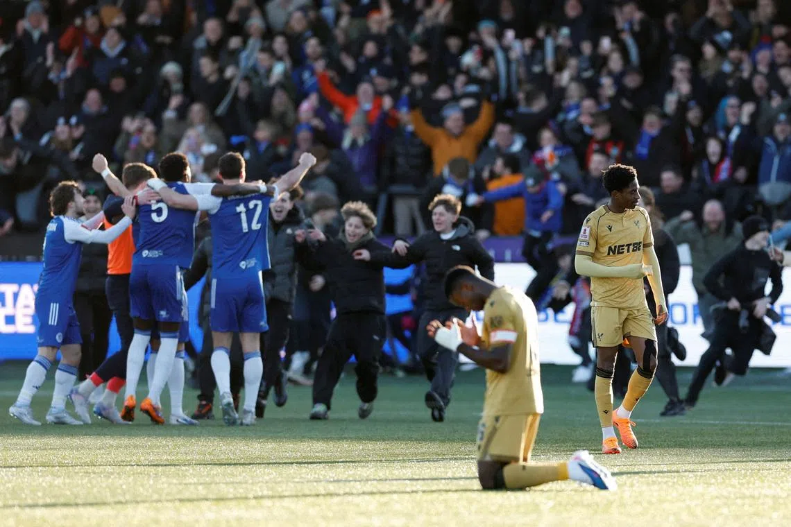 FILE PHOTO: Soccer Football - FA Cup - Third Round - Macclesfield F.C. v Crystal Palace - Moss Rose, Macclesfield, Britain - January 10, 2026 Crystal Palace's Marc Guehi looks dejected as Macclesfield F.C. players celebrate after the match Action Images via Reuters/Jason Cairnduff/File Photo