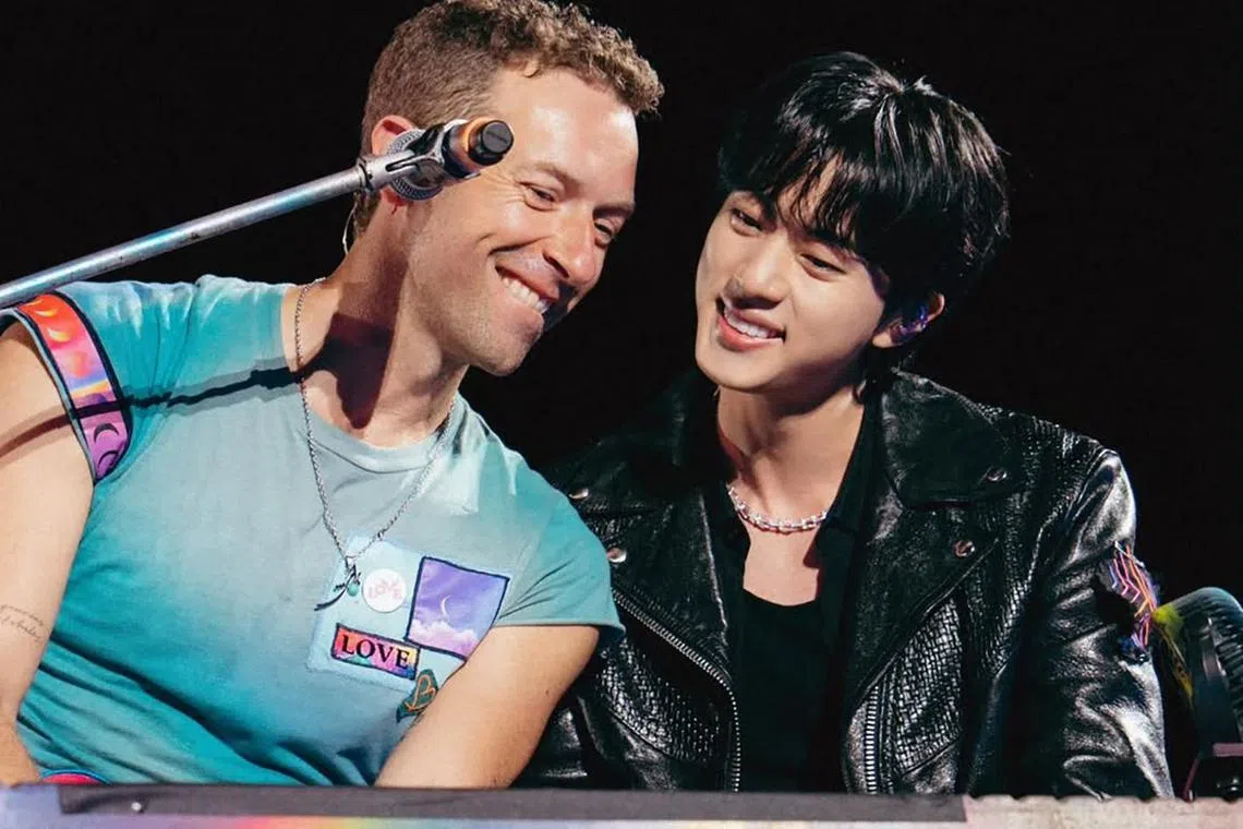 Coldplay frontman Chris Martin (left) with K-pop boy band BTS' Jin at the British band's concert in South Korea on April 19. Jin showed up as a surprise guest to sing The Astronaut, a solo song of his co-written by Coldplay.