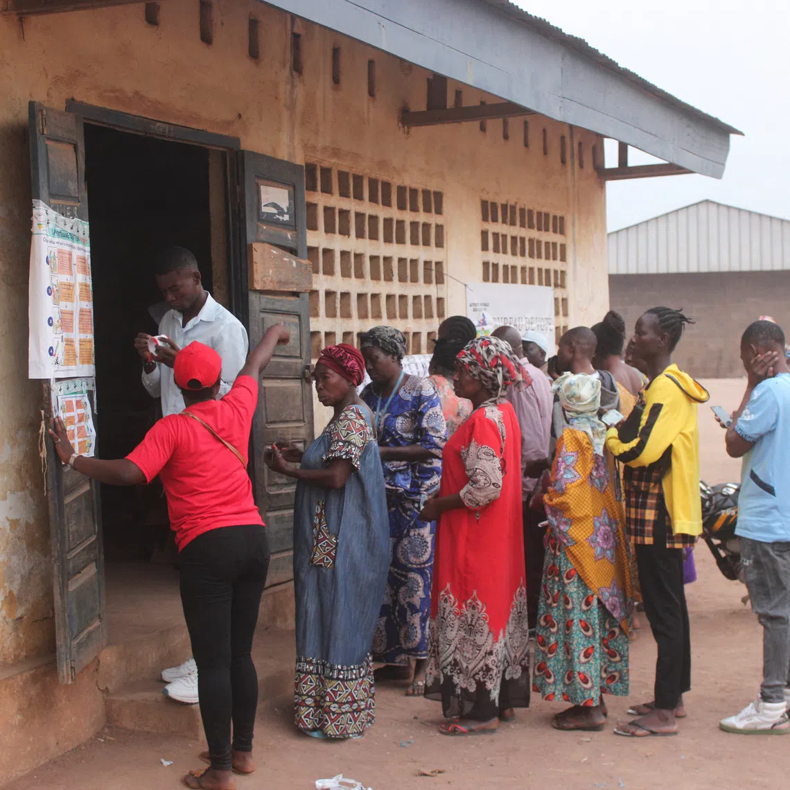 People wait to cast their vote at a polling station during the presidential election in Bangui, Central African Republic, December 28, 2025. REUTERS/ Leger Serge Kokpakpa