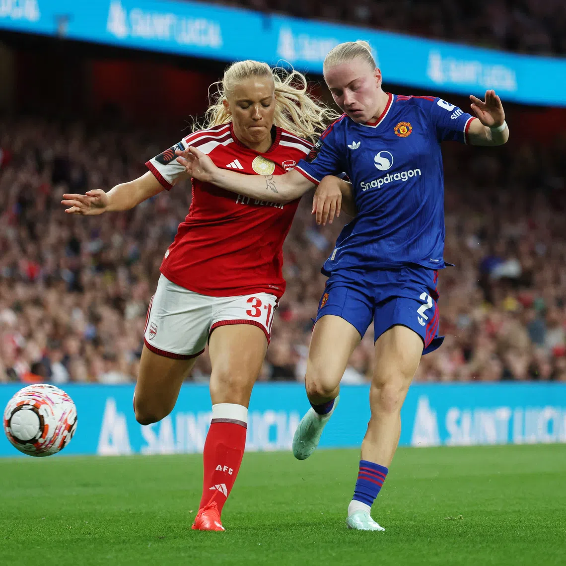 Soccer Football - Women's Super League - Arsenal v Manchester United - Emirates Stadium, London, Britain - September 19, 2026 Arsenal's Smilla Holmberg in action with Manchester United's Anna Sandberg Action Images via Reuters/Cat Goryn