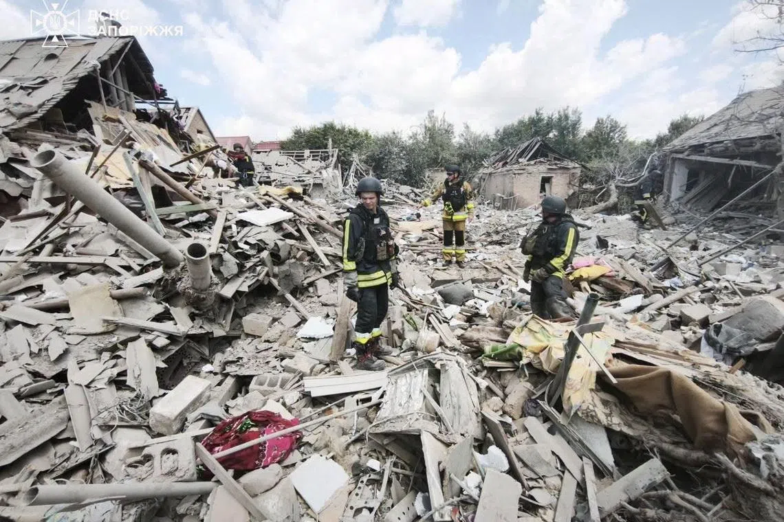 Rescuers work at a site of a Russian air strike, amid Russia's attack on Ukraine, in Zaporizhzhia, Ukraine in this handout picture released June 28, 2026. Press service of the State Emergency Service of Ukraine in Zaporizhzhia region/Handout via REUTERS