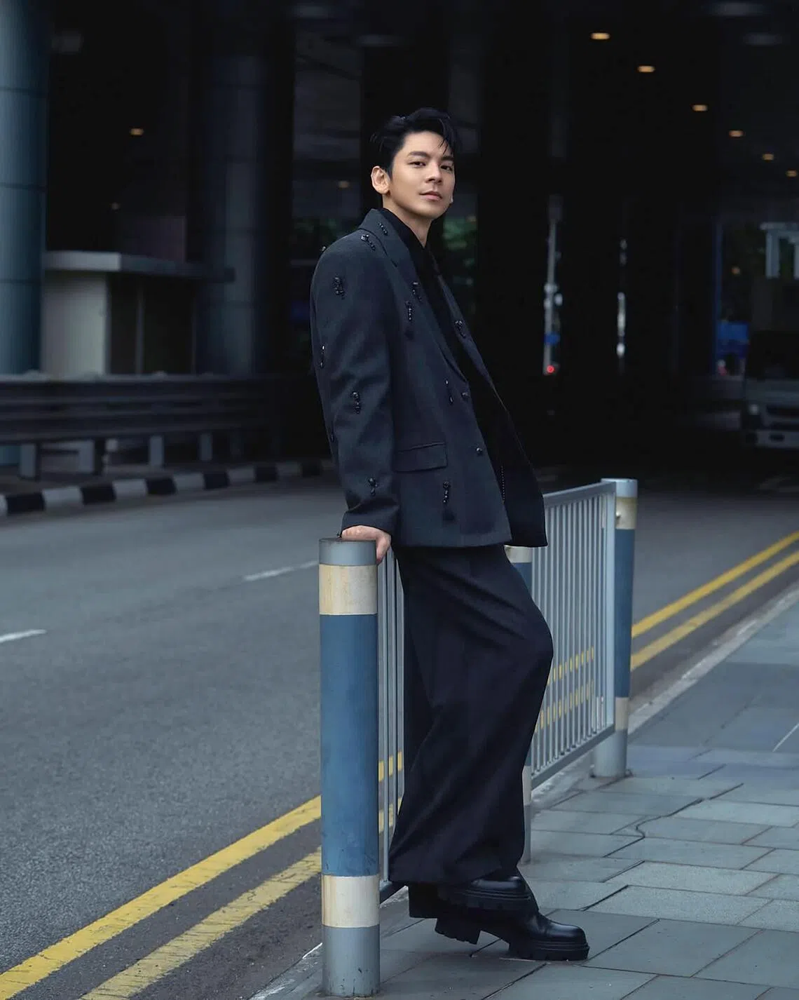 Taiwanese actor Austin Lin posing near Suntec City in late 2025.