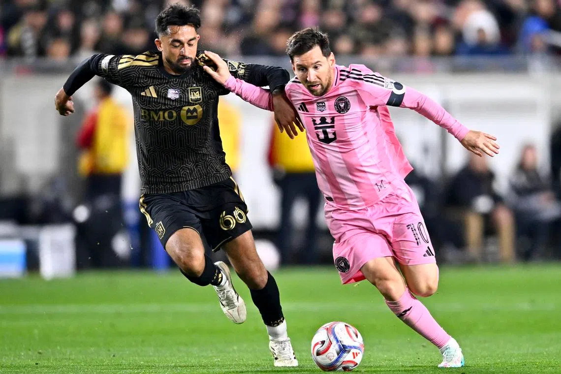 Feb 21, 2026; Los Angeles, California, USA; Inter Miami CF forward Lionel Messi (10) moves the ball against Los Angeles FC midfielder Mathieu Choinière (66) during the second half at Los Angeles Memorial Coliseum. Mandatory Credit: Kelvin Kuo-Imagn Images