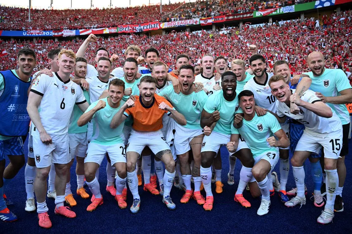 FILE PHOTO: Soccer Football - Euro 2024 - Group D - Netherlands v Austria - Berlin Olympiastadion, Berlin, Germany - June 25, 2024 Austria players celebrate after the match REUTERS/Annegret Hilse/File Photo