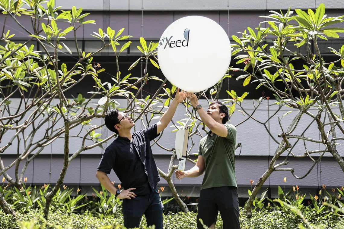 (From left) Postdoctoral research fellows Mr Danial Sufiyan Shaiful and Mr Shane Kyi Hla Win were inspired by the maple seed to create a solution that can reduce electronic waste and make weather monitoring more sustainable. They won the James Dyson Award 2024 for sustainability.
