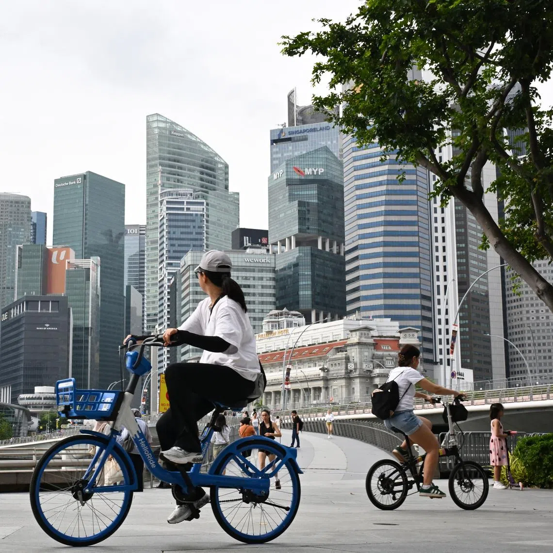 Cyclists and people near the Jubilee Bridge with the Central Business District (CBD) skyline on Dec 31, 2025.  The top lesson from immigration convulsions elsewhere is to do everything possible to avoid the toxicity of conversations rooted in zero-sum politics.