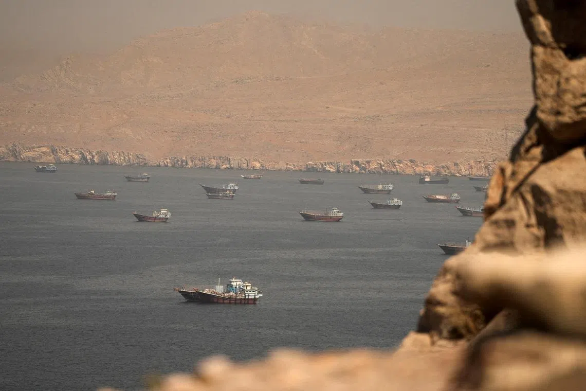 FILE PHOTO: Vessels at the Strait of Hormuz, as seen from Musandam, Oman, June 18, 2026. REUTERS/Stringer/File Photo