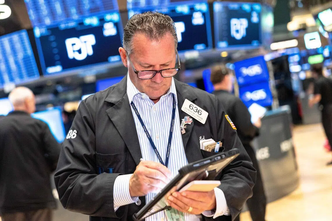 Traders working on the floor of the New York Stock Exchange during morning trading on July 17, in New York City.
