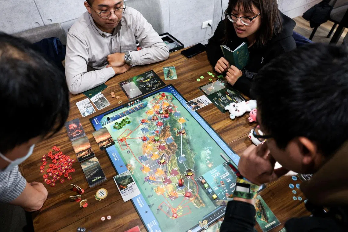 Board game enthusiasts play "2045", set in the backdrop of a fictional armed conflict in Taiwan some twenty years into the future.
