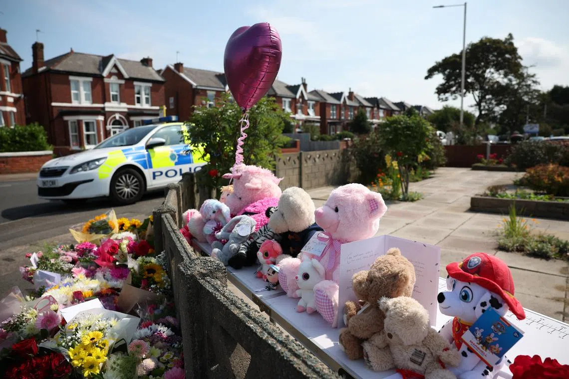 Tributes left at the scene of a stabbing attack in Southport, England, on July 30.